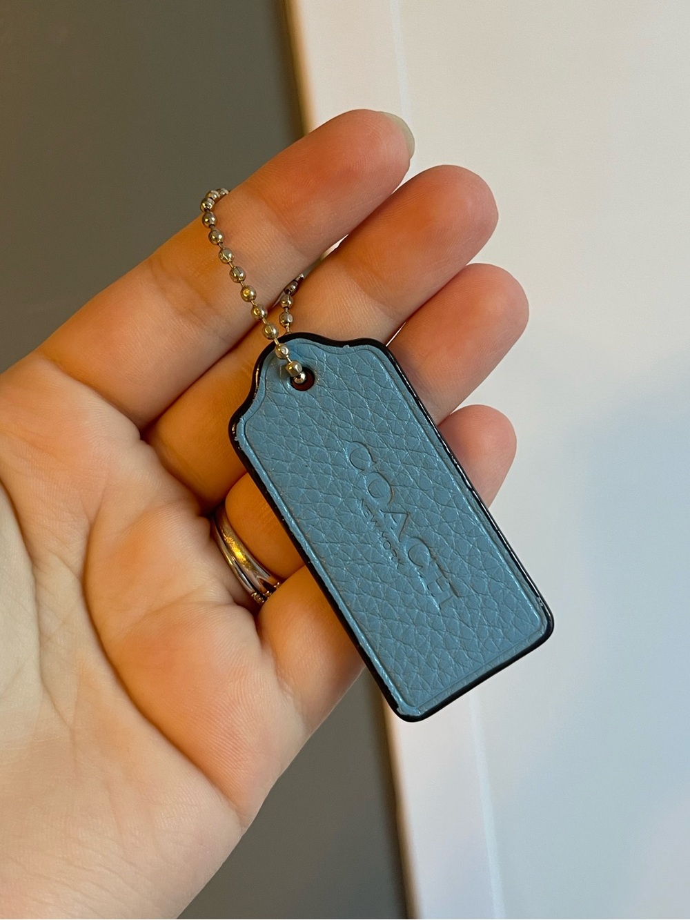 Blue coach hangtag